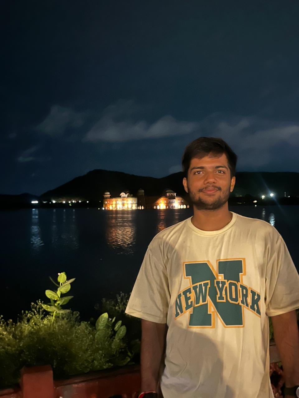 Amartya beside the lake in Jaipur at night