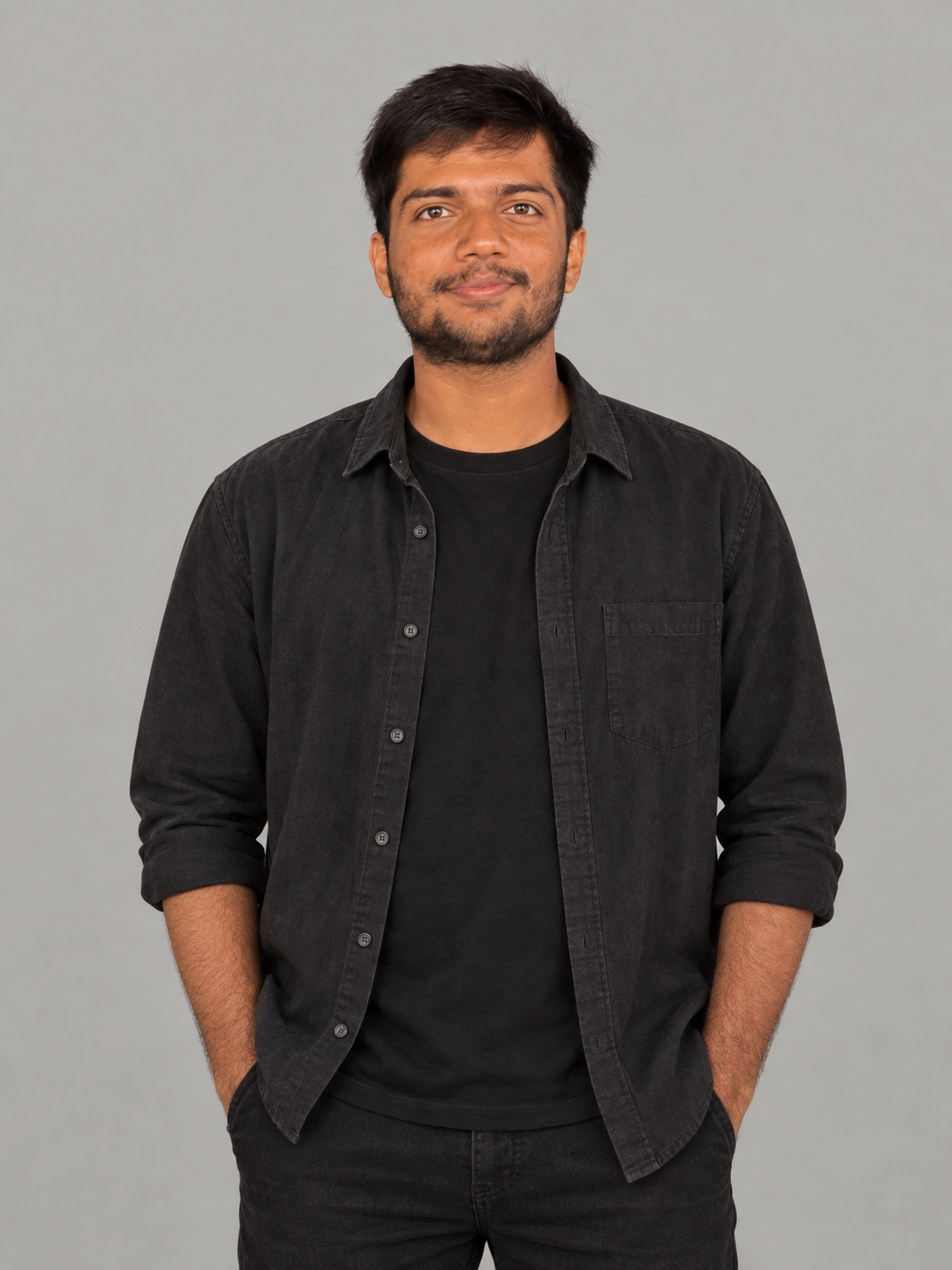 Studio portrait of Amartya in a charcoal overshirt
